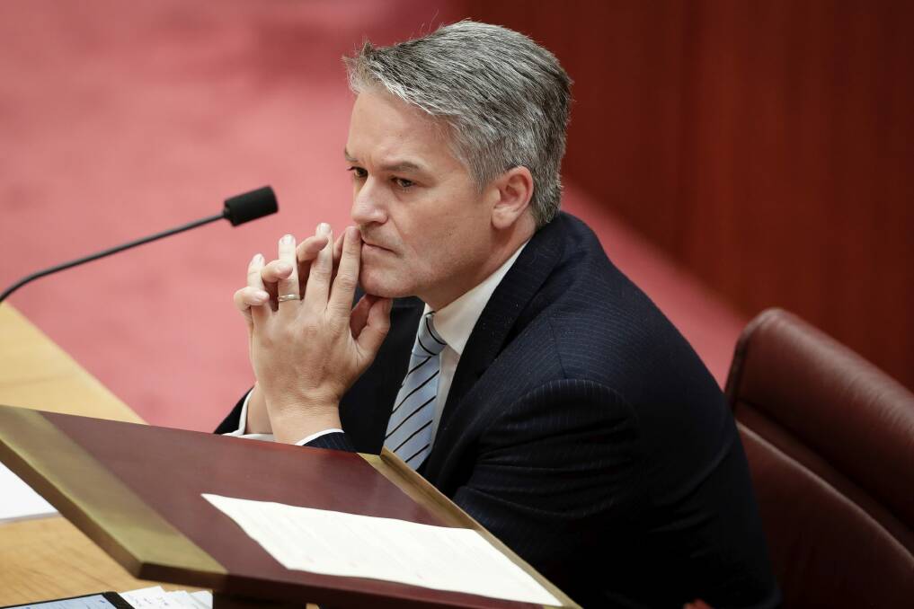 Minister for Finance Mathias Cormann has been urged to lift caps on public servant numbers Photo: Alex Ellinghausen