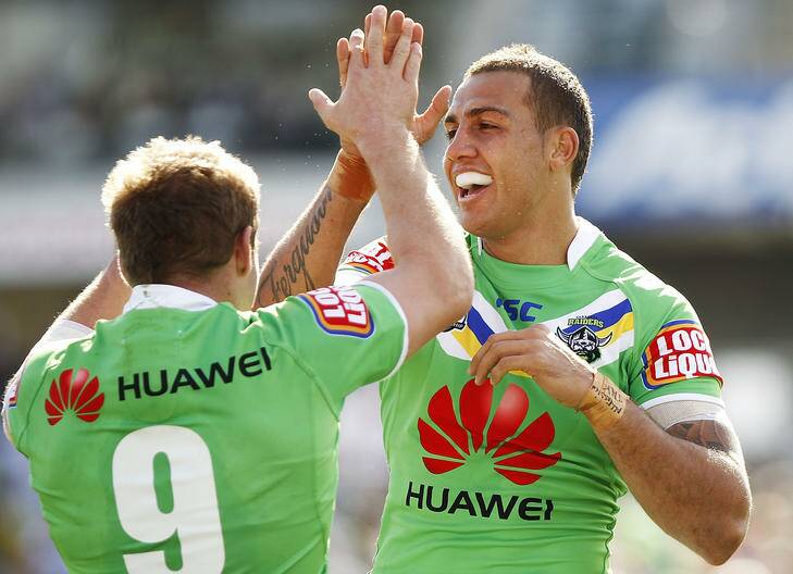 Blake Ferguson and Glen Buttriss of the Raiders celebrate a try during the round six NRL match between the Canberra Raiders and the New Zealand Warriors. Photo: Getty Images