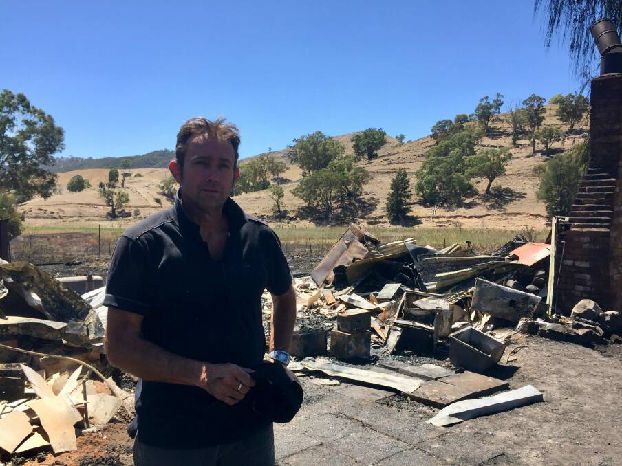 Adrian King, who was renovating the pub, in front of the ruins of the Stables Tavern in Wee Jasper. Photo: Toby Vue