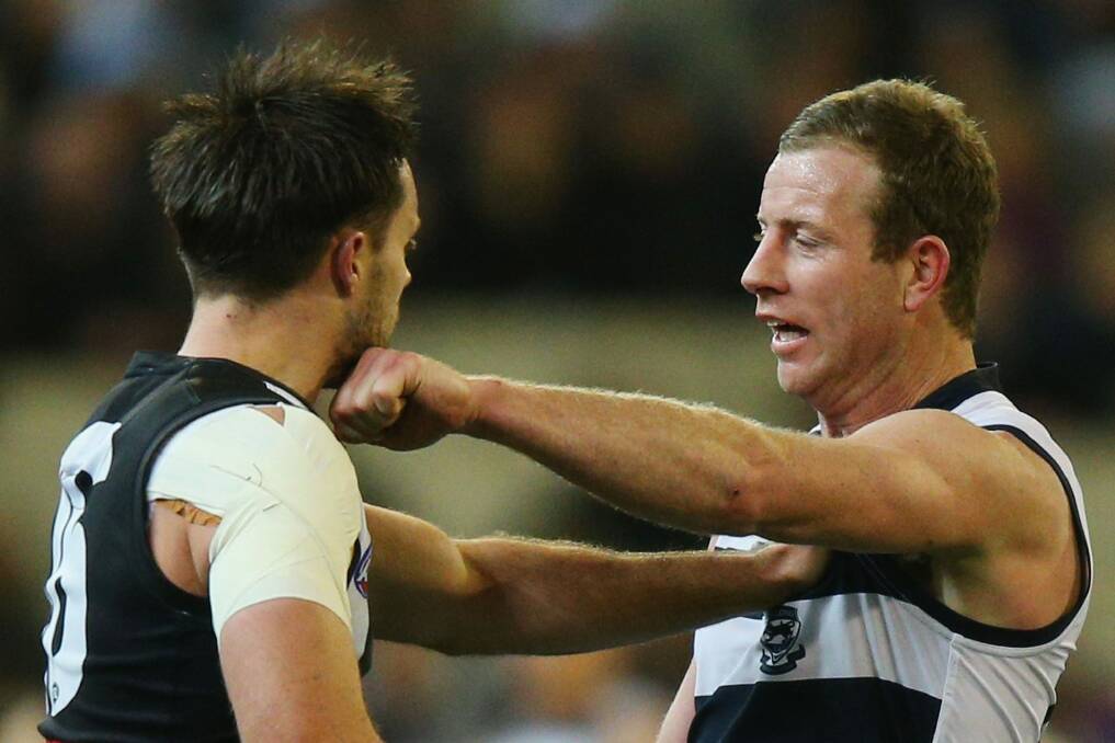 Here's one for you: Geelong's Steve Johnson locks horns with Nathan Brown of the Magpies. Photo: Getty Images