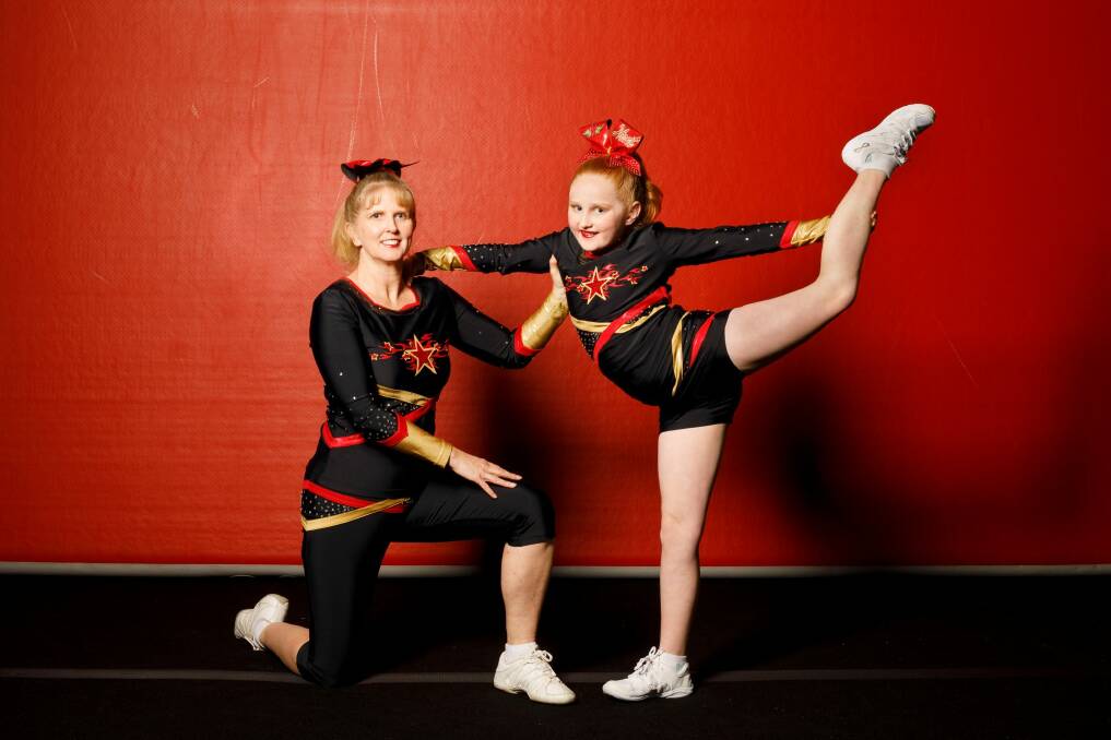Heat Cheerleading owner Bronwyn Morgan with her 10-year-old daughter Dani McHugh. Photo: Sitthixay Ditthavong