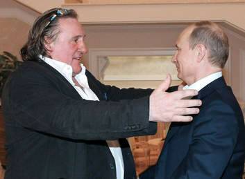 Russian President Vladimir Putin greets French actor Gerard Depardieu.
