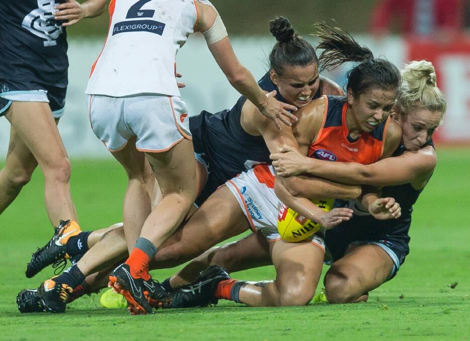 Rebecca Beeson of the Giants is tackled during the GWS Giants and Carlton game at Drummoyne Oval. Photo: Craig Golding
