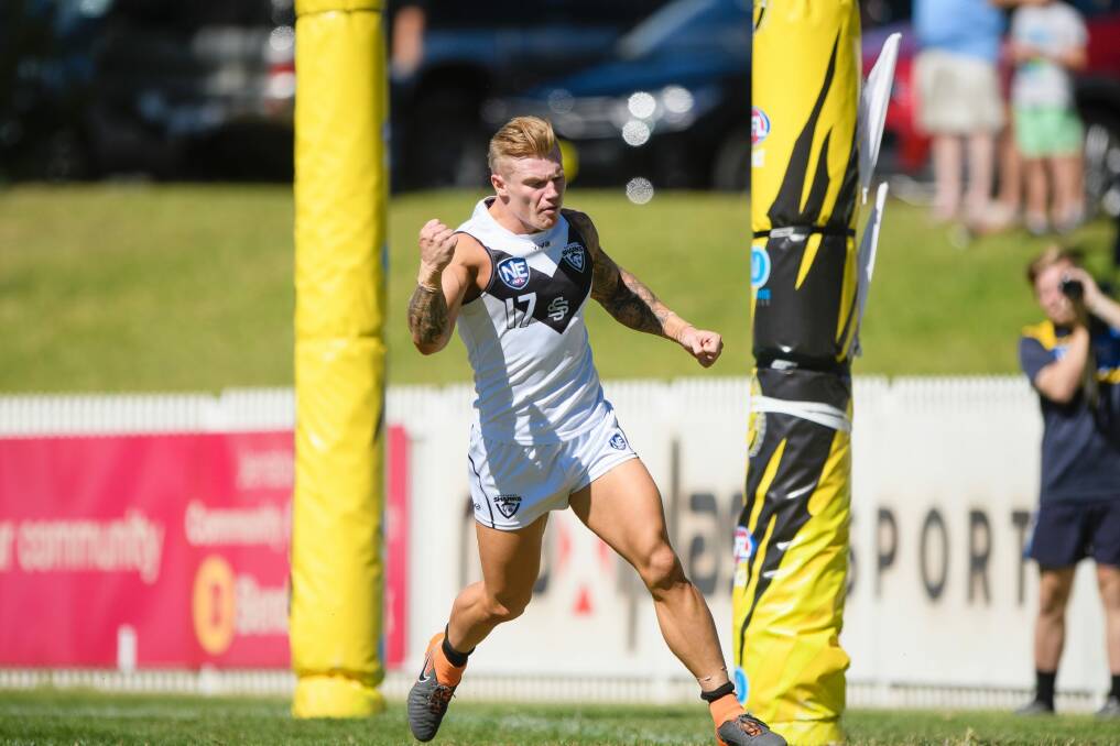 Southport Sharks' Mitch Johnson reacts after kicking a goal during the NEAFL season opener against the Canberra Demons.  Photo: Sitthixay Ditthavong
