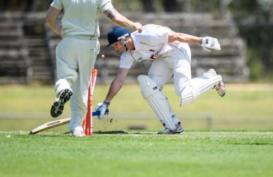 Wests-UC's Josh Boyd survives a run-out attempt. Photo: Sitthixay Ditthavong Photo: Sitthixay Ditthavong