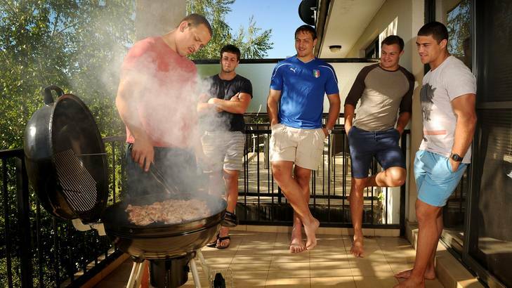 Brumbies players Ruan Smith, Ian Prior, Etienne Oosthuizen, Stephan Van Der Watt and Mark Swanepoel enjoy a barbecue on Saturday. Photo: Colleen Petch