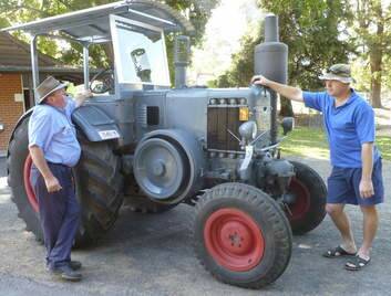 Ross Umbers and his son Glen inspect a Lanz Bulldog tractor.