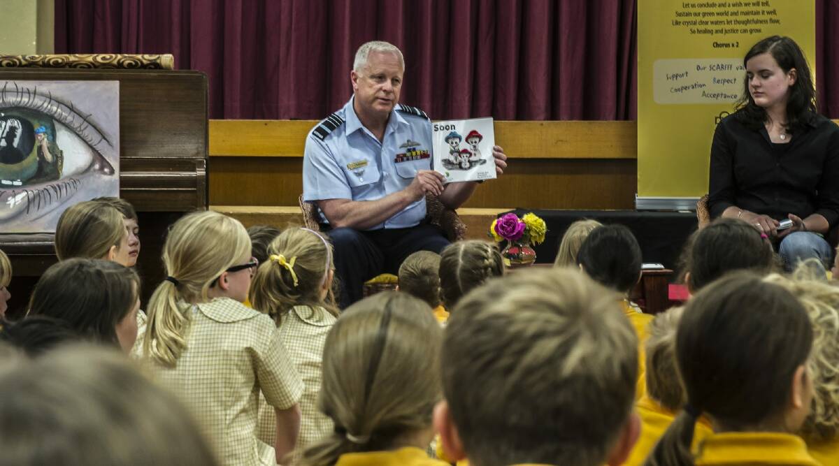 Teen author Jessica Love and Chief of Defence Force Air Chief Marshal Mark Binskin read Soon to pupils at Campbell Primary School. Photo: Karleen Minney