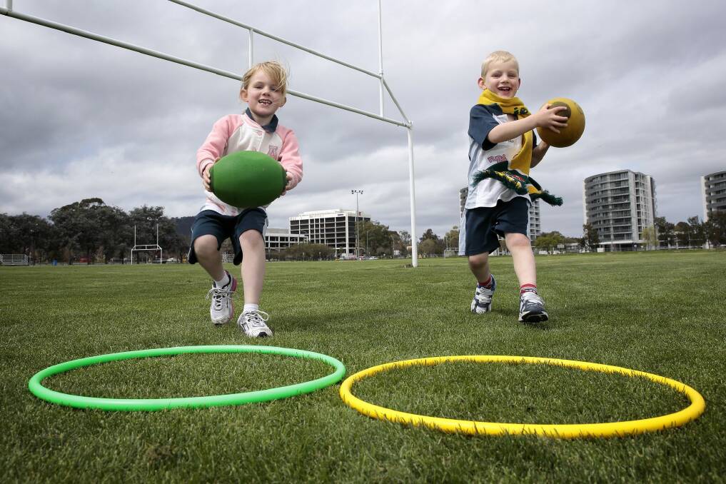Isobel Marlow 6 of Franklin and Oscar Marlow 4 at Rugbytots at Southwell Park in Lyneham.  Photo: Jeffrey Chan