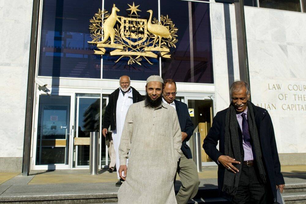 Canberra Muslim Community members, Mohammed Yunus, President Yasser Dabhoiwala, Nazre Sobhan, and Borhan Ahmed outside the ACT Supreme Court. Photo: Jay Cronan