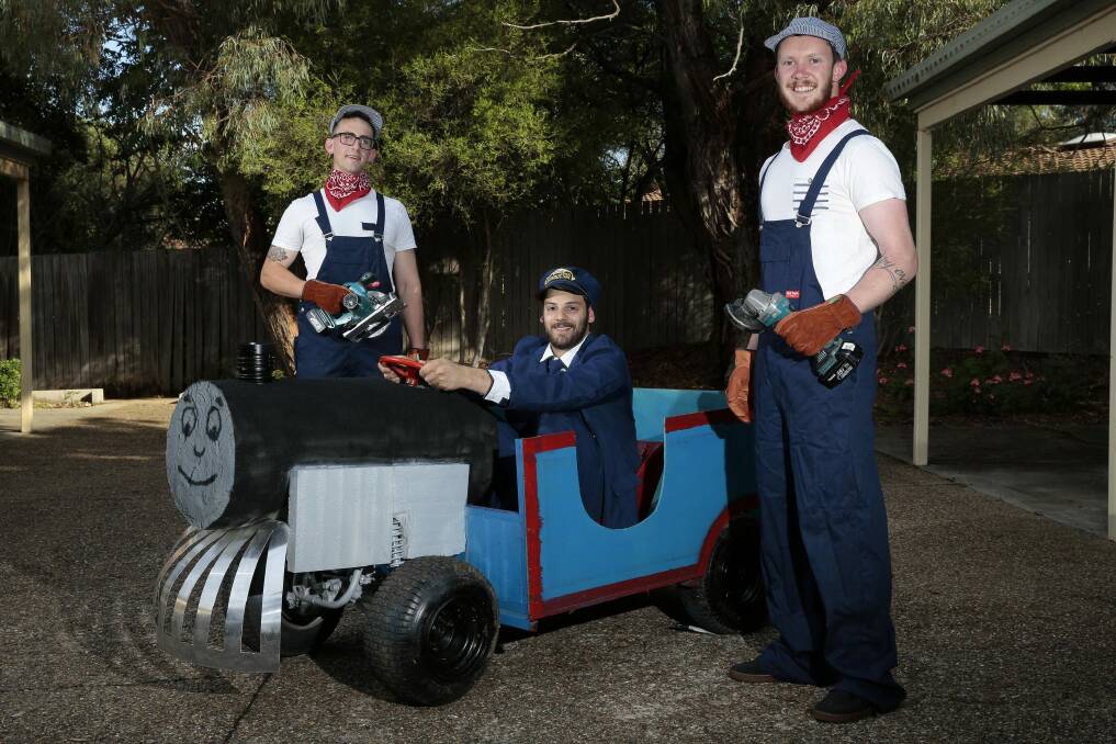 Aaron Dixon of Braddon, Dimitri Markakis of Belconnen and Mitchell Searle of Belconnen with their two-seater billy cart. Photo: Jeffrey Chan