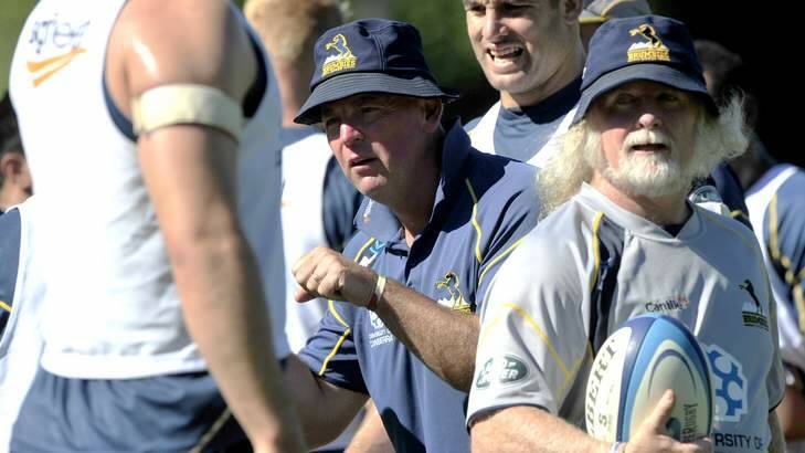 Brumbies Coach Jake White, centre, and Laurie Fisher, right, during training. Photo: Jay Cronan