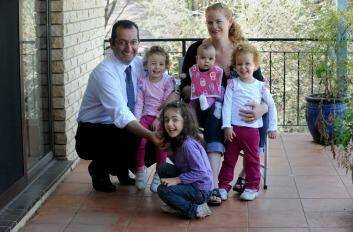 Elias Hallaj and wife Vanessa at home in MacGregor with  their  four girls Renee, Jasmine,  Michaela and Rachel. Photo: Richard Briggs