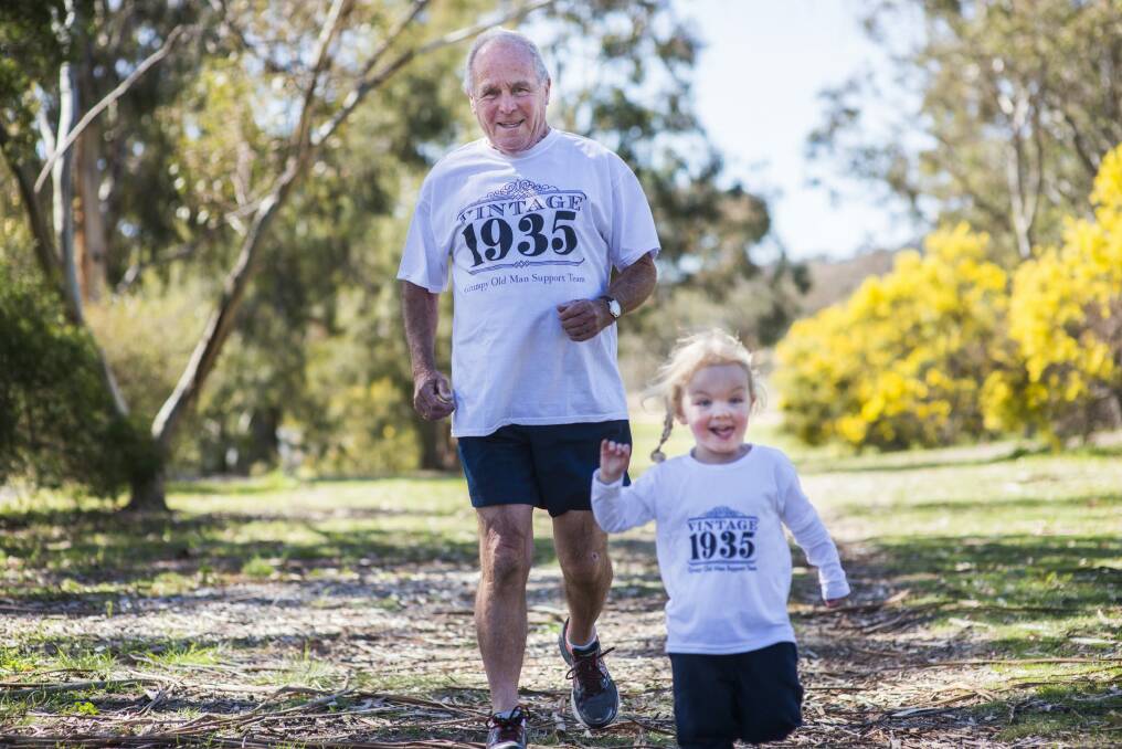 Leslie Ion prepares for the Fun Run with his great-granddaughter, Annika Back, 2. Photo:  Rohan Thomson
