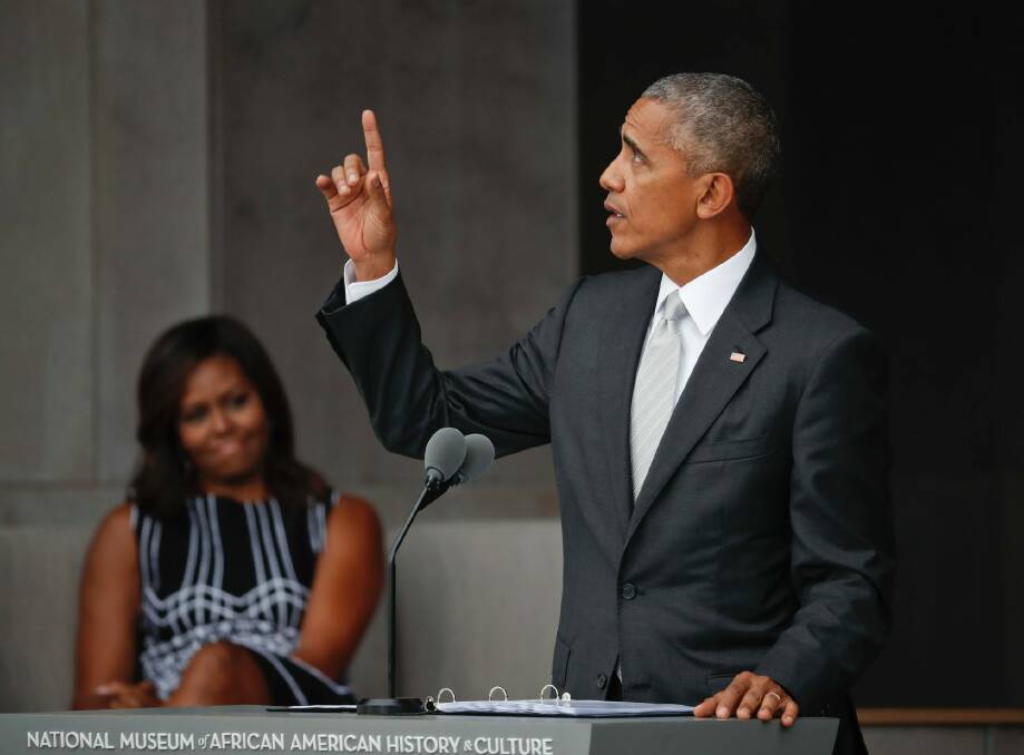 US President Barack Obama and first lady Michelle Obama at the dedication ceremony for the Museum of African American History and Culture on the National Mall in Washington. Photo: PABLO MARTINEZ MONSIVAIS
