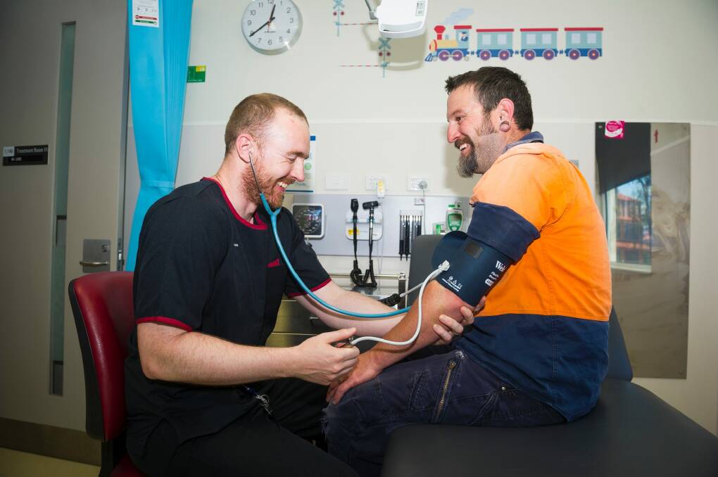 Nurse practitioner David Sander and patient Daniel Fitzpatrick. Photo: Dion Georgopoulos