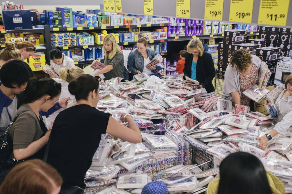 Shoppers at Aldi in Gungahlin to buy new Collette Dinnigan children's clothes. Photo: Rohan Thomson