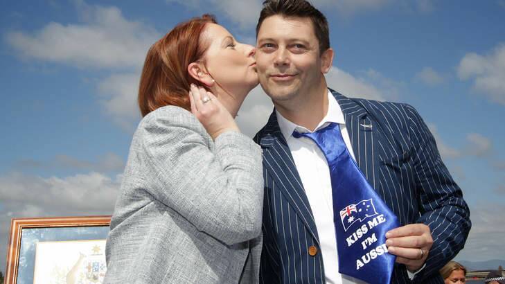 Prime Minister Julia Gillard gives new Australian citizen Ian Mears (previously from London) a kiss, at a citizenship ceremony in Canberra. Photo: Alex Ellinghausen