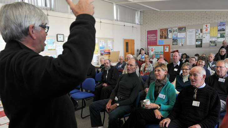 ON SONG: Colin Slater from Sing Australia conducts the singing at a Parkinson’s ACT meeting at the Pearce Community Centre last week. Photo: Graham Tidy