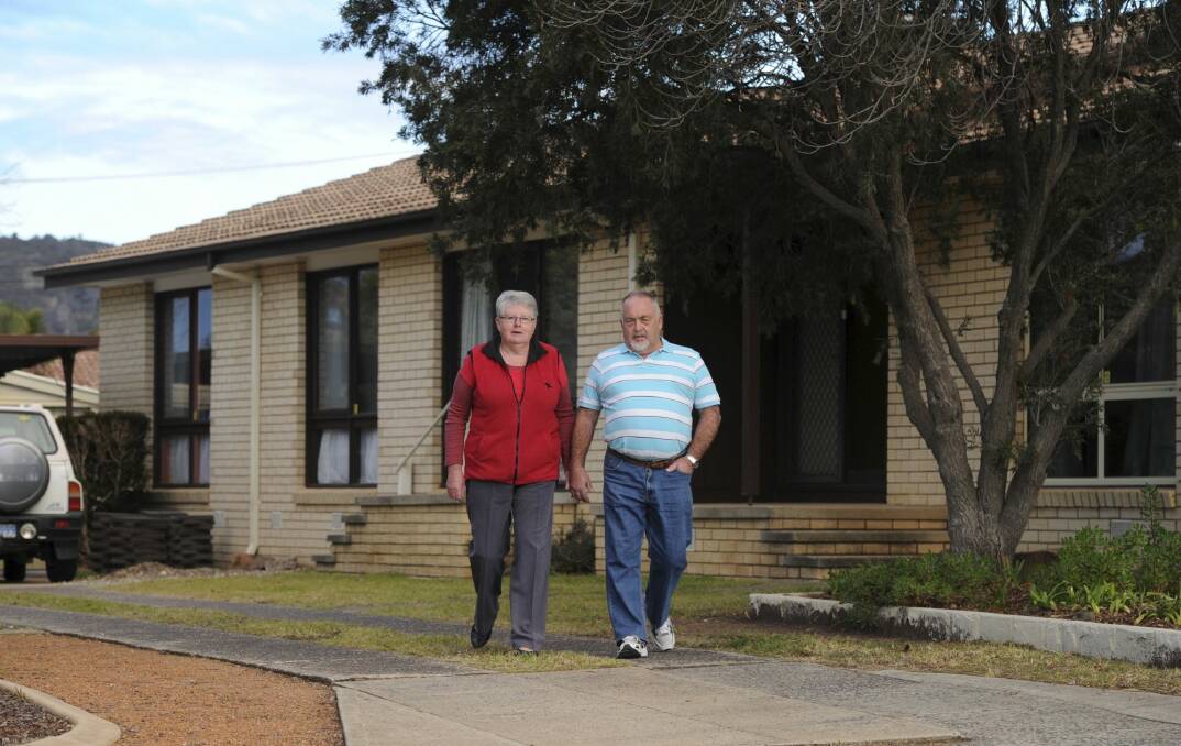 Owners of a Mr Fluffy home in Wittenoom Crescent, Stirling -
Barbara and Terry Bennett in front of their home of over 40 years. Photo: Graham Tidy