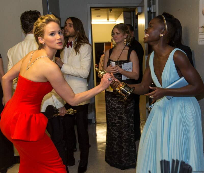 Jennifer Lawrence and Lupita Nyong'o hamming it up for the cameras backstage at the 2014 Oscars.