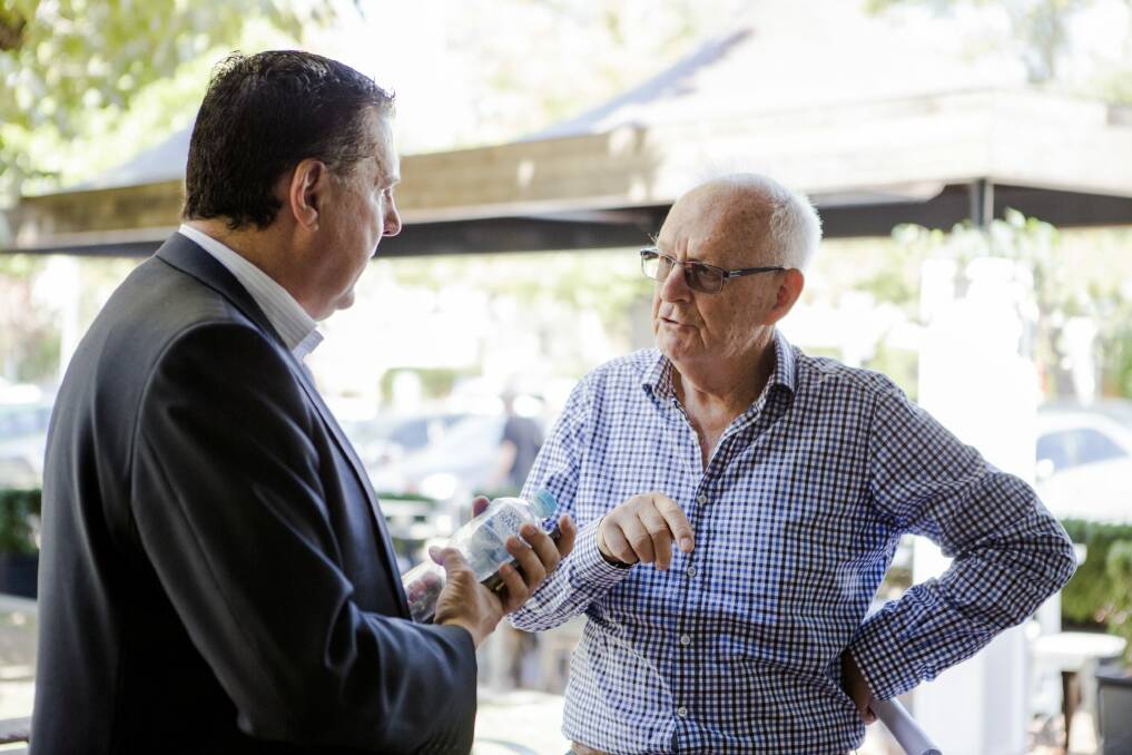 Greater Western Sydney chief operating officer Richard Griffiths speaks to resident John Nutt at Manuka earlier this month. Photo: Jamila Toderas