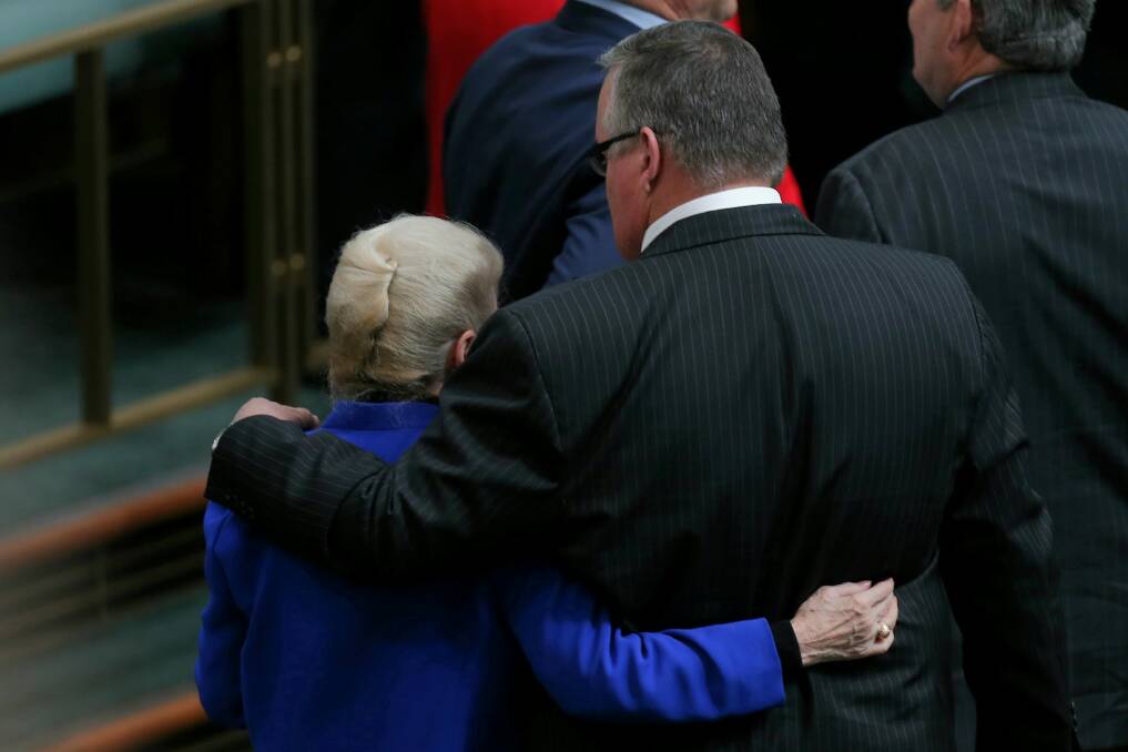 Coalition MP Ewen Jones walks out of the chamber with former Speaker Bronwyn Bishop after incoming Speaker Tony Smith was 'dragged' to the Speaker's chair. Photo: Alex Ellinghausen
