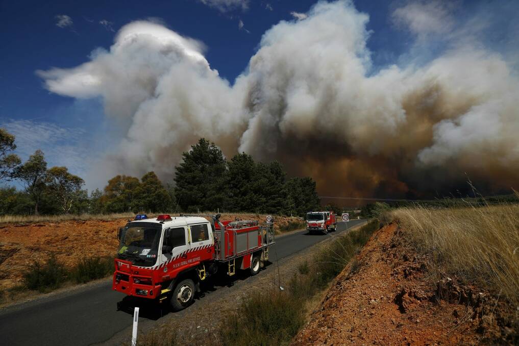Firefighters respond to a fire at Carwoola, southeast of Canberra. Photo: Alex Ellinghausen