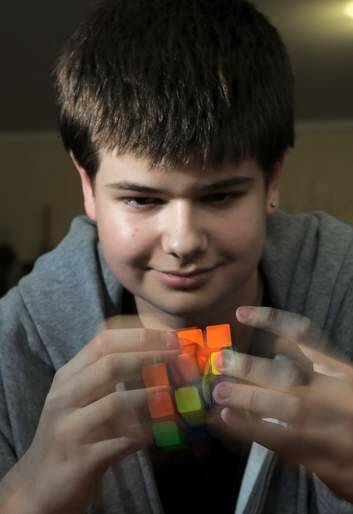 Rubiks cube exponent, 14 year old Jayden McNeill at his home in Weston on Wednesday. Photo: Graham Tidy