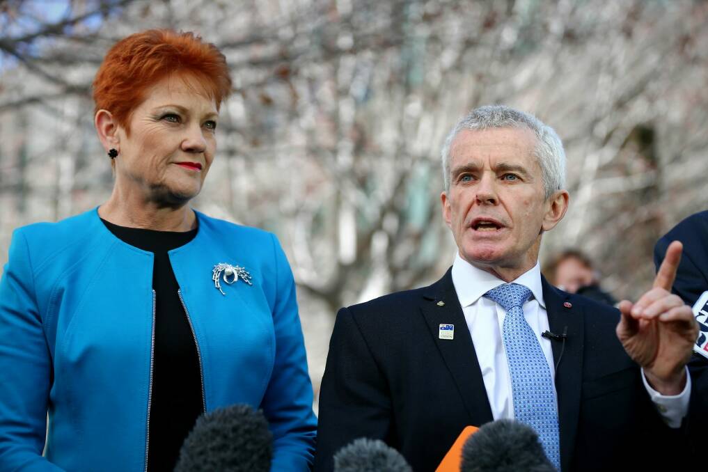 The report says One Nation's four senators - including Pauline Hanson and Malcolm Roberts - were elected on the back of a platform which included ceasing Muslim immigration. Photo: Alex Ellinghausen