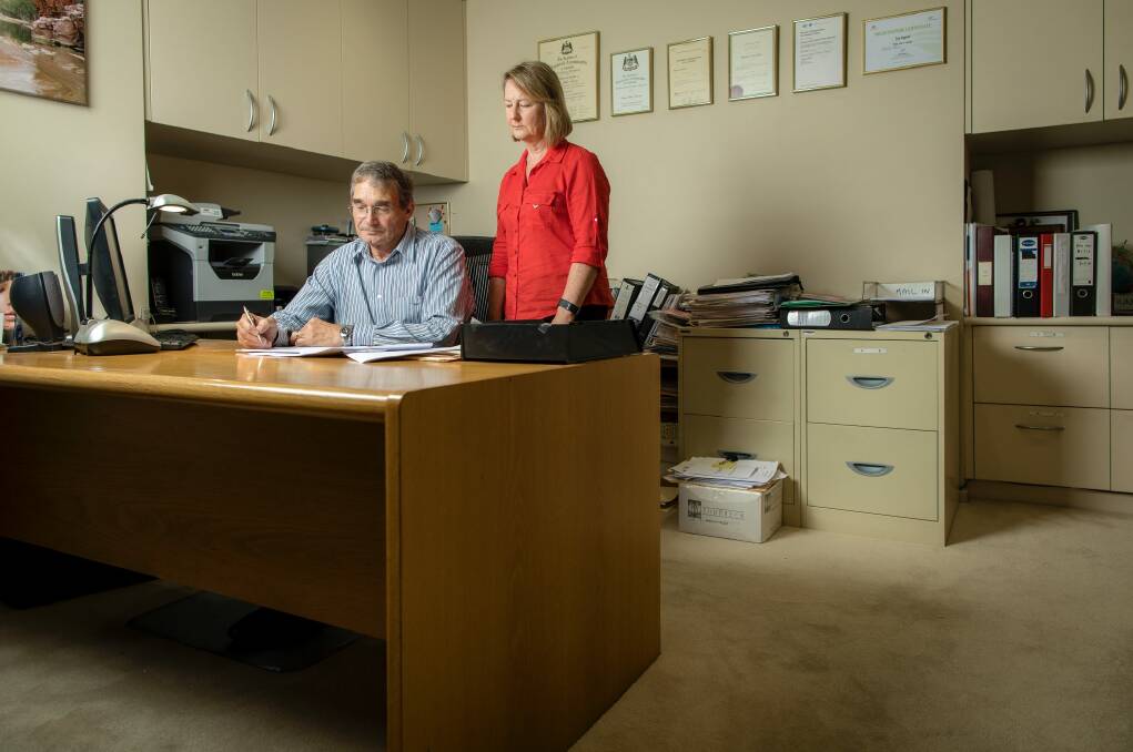 Peter and Maree Toscan in Peter's home office, where Buzz would spend much of the day under the desk at his owner's feet.  Photo: Sitthixay Ditthavong