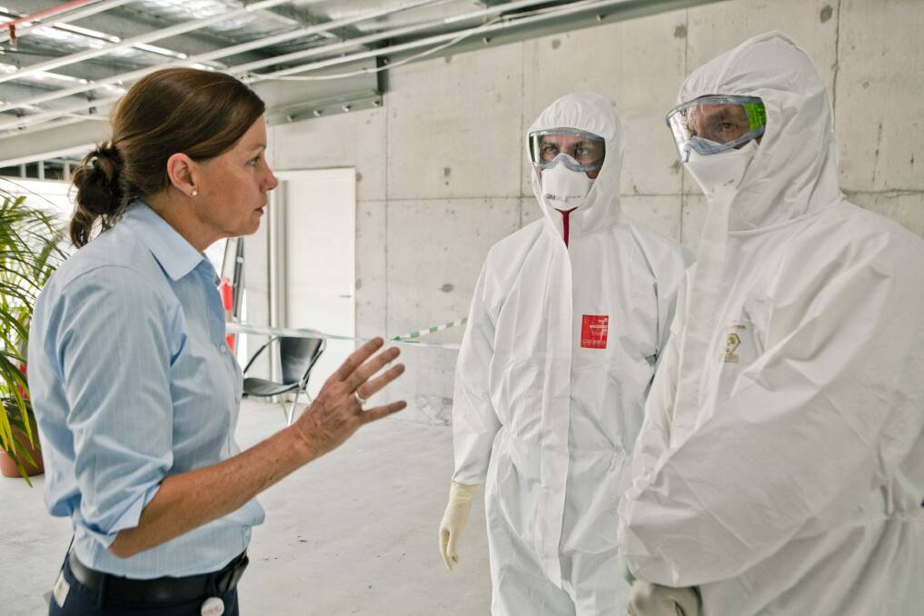Jane Armstrong, Aspen Medical Clinical Training Manager, Dr John Gerrard and Dr John Parker taking part in predeployment Ebola training in Canberra. Photo: Supplied