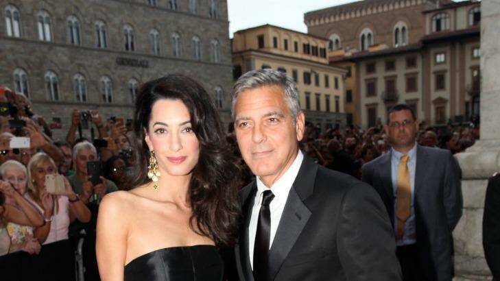 The couple stayed close during their first public outing in Italy, ahead of their wedding in the coming days. Photo: Getty Images