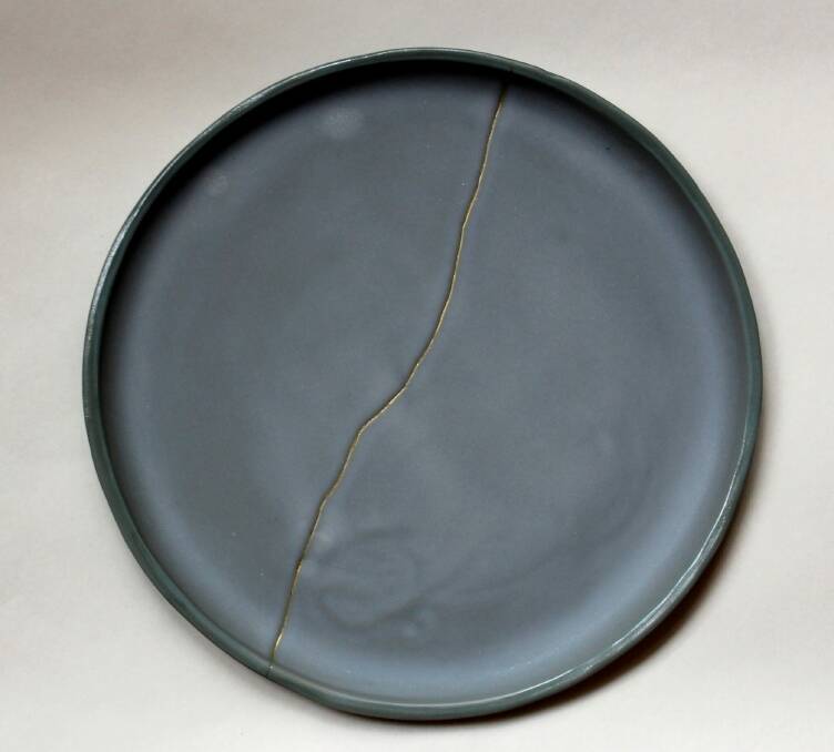 This broken plate was repaired with gold using the Japanese art of kintsugi.  Photo: Supplied