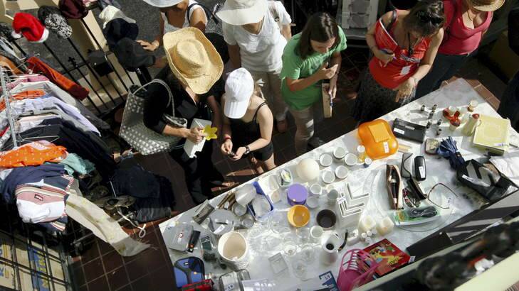 People shopping at a garage sale. Photo: Wolter Peeters
