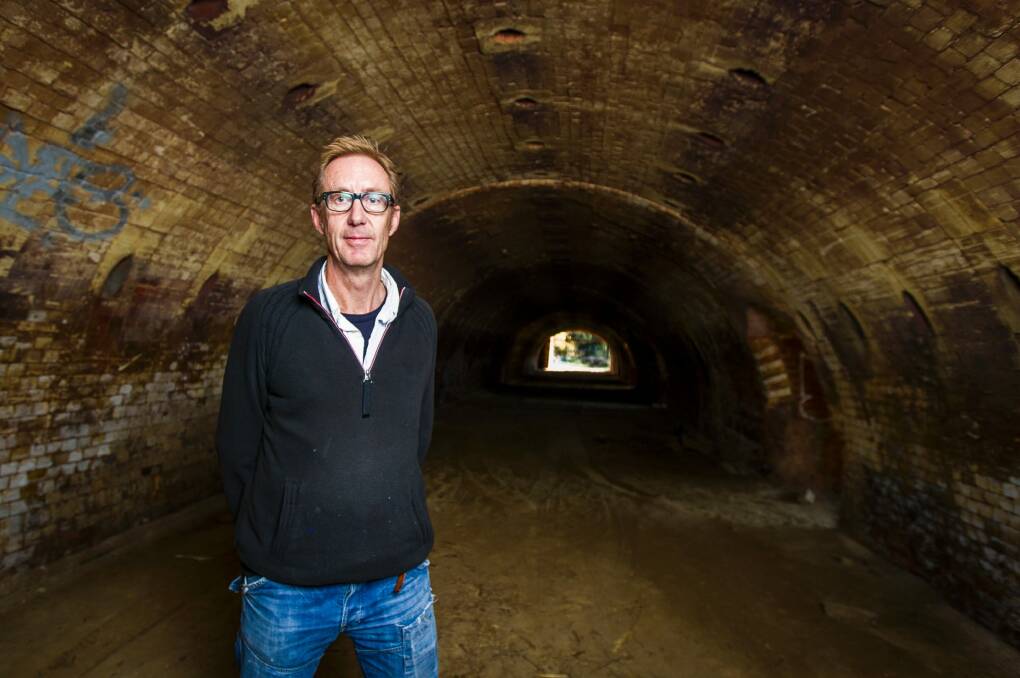 Artist Peter Vandermark inside one of the remarkable abandoned kilns at the brickworks site. Photo: Dion Georgopoulos