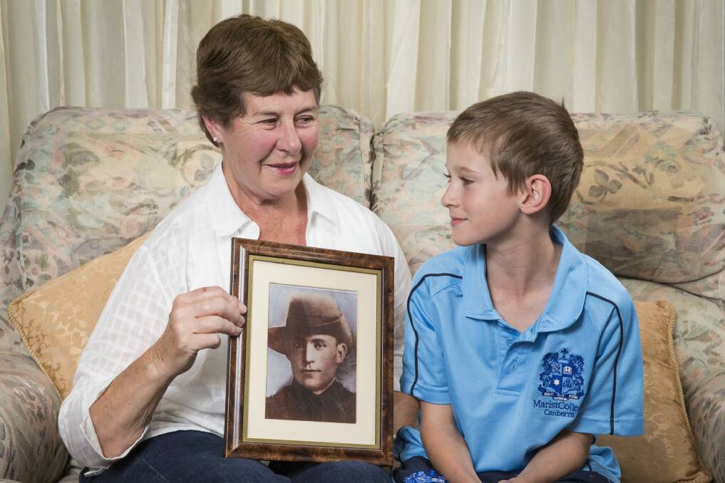 Maureen Blackmore and her grandson Nic Blackmore, 9, with a photo of her grandfather Thomas Johnson from Gallipoli and France during WWI. 
 Photo: Matt Bedford