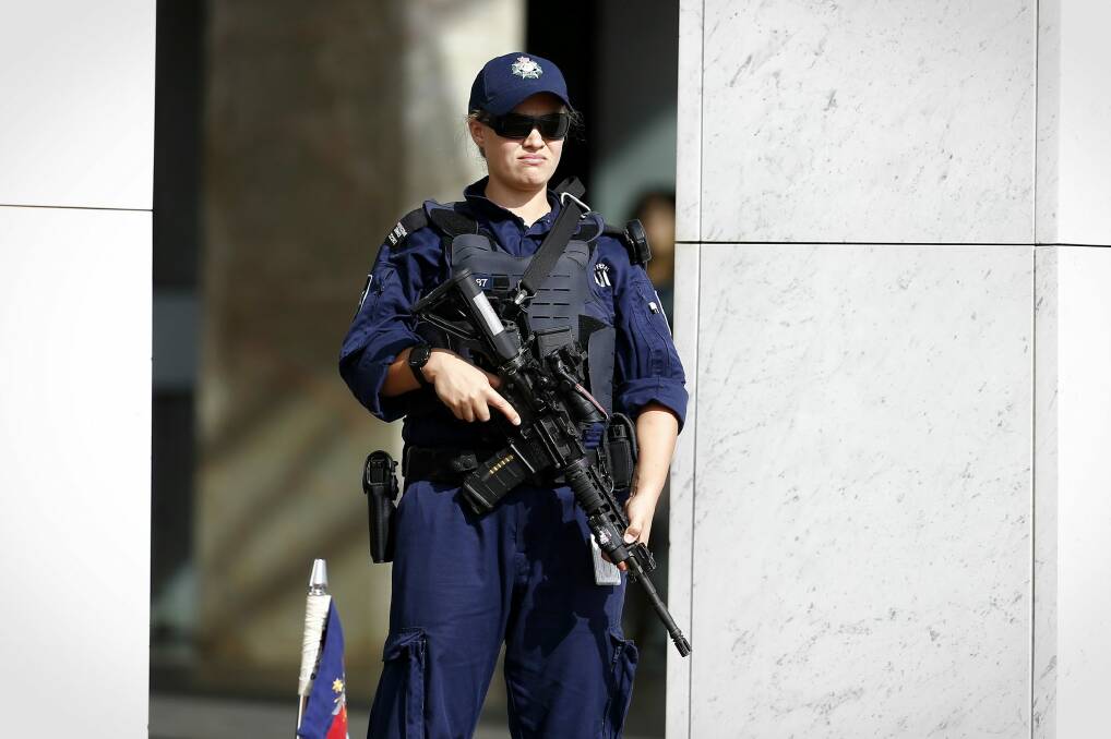 Security outside Parliament House in March.  Photo: Alex Ellinghausen