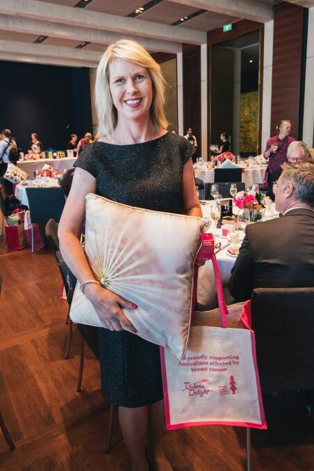 Breast cancer surviver Sonja Loder of Casey with the fundraising cushions at the Pink Lady luncheon for Breast Cancer Network Australia. Photo: Rohan Thomson