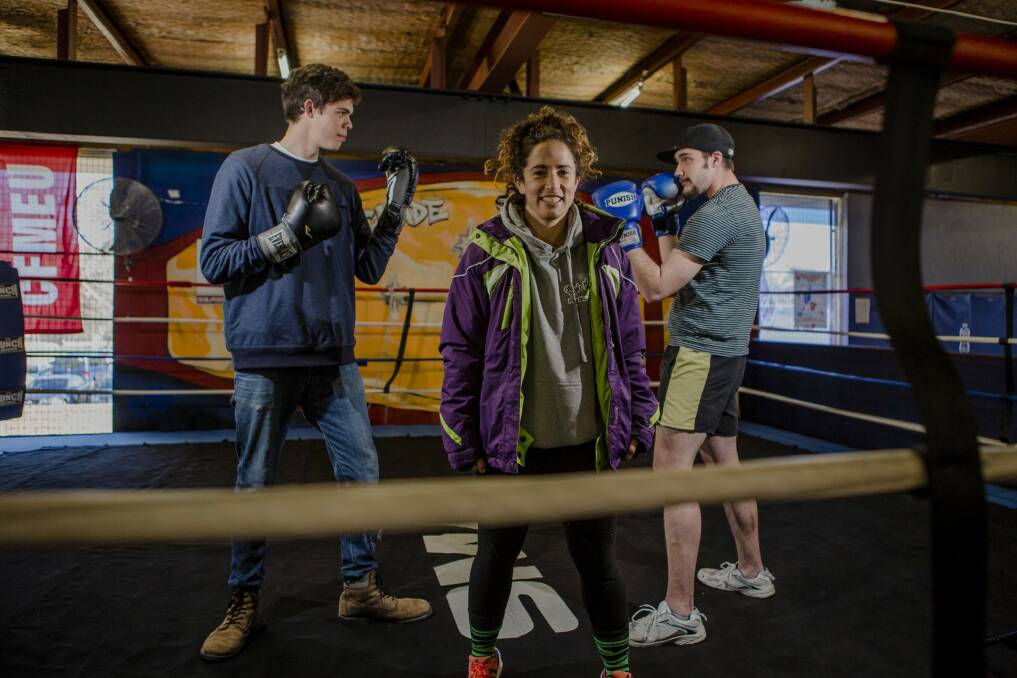 Pilot program for vulnerable youth at Stockade training centre. Front, Canberra boxer Bianca Elmir, with two students who are part of the program (from left) Michael Watt, 20, and Lachlan Thinius, 22. Photo: Jamila Toderas