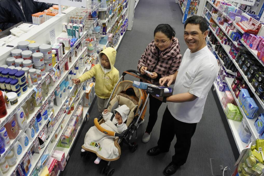 Pharmacist Ben Jackson with Cherry Yang and children Adam, 4, and Sophia, 6 months.  Photo: Georgina Connery