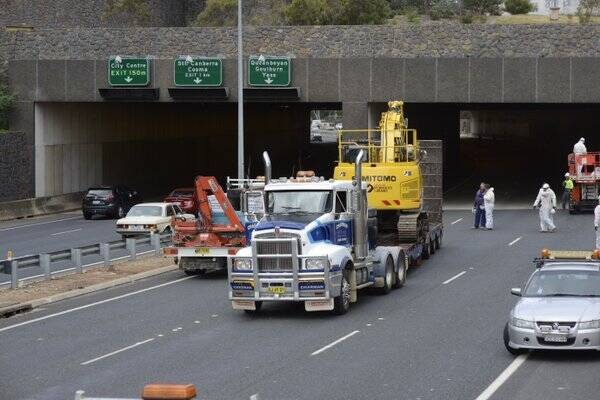 The truck and excavator are freed from the Acton Tunnel after being stuck for two days. Photo: ACT ESA