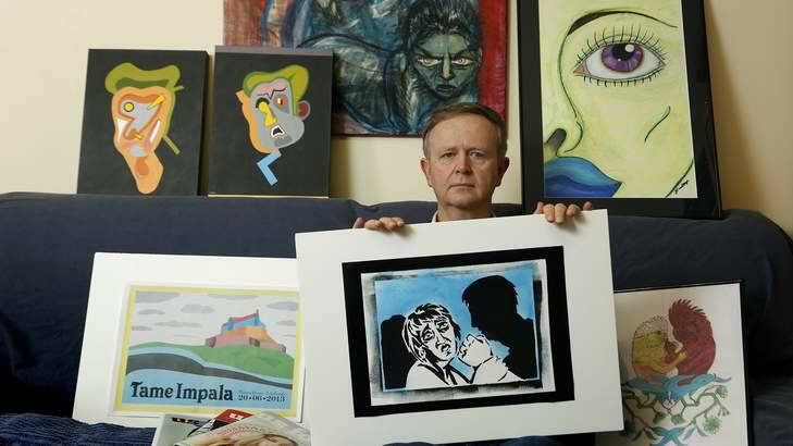 PROUD DAD: Bill Dudley at home in Melba with works by his daughter Juliette and son Ian. Mr Dudley is concerned about the increase in fees for graphic design at CIT. Photo: Jeffrey Chan