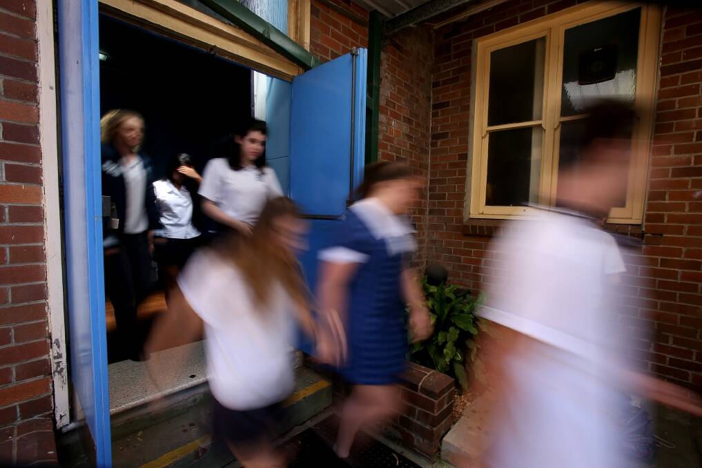 A video was posted online on a popular Canberra Facebook page on Wednesday night purporting to show one girl assaulting another girl at a Canberra school. Photo: Robert Peet