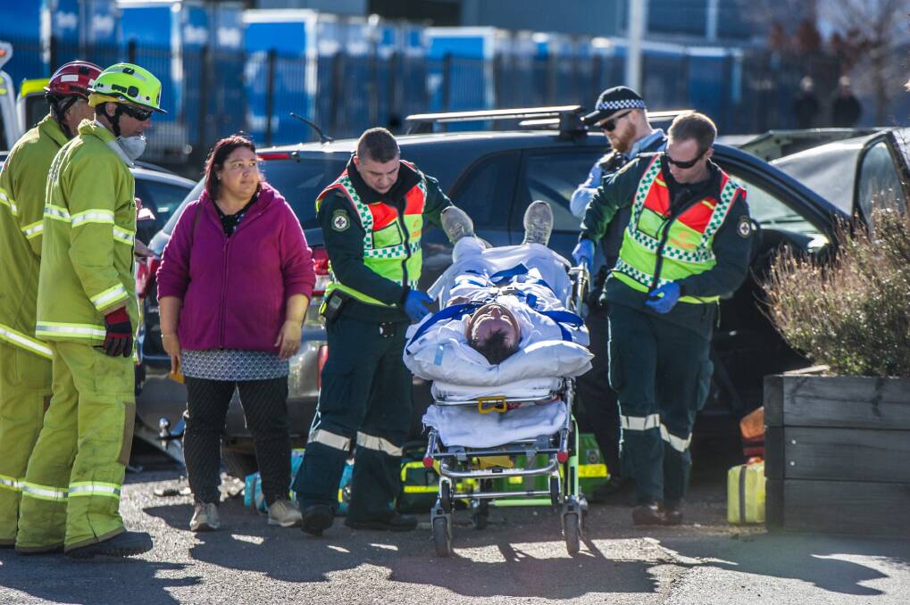 Police, paramedics and firefighters attend the scene of a four-car crash in Fyshwick on Wednesday morning. Photo: Karleen Minney