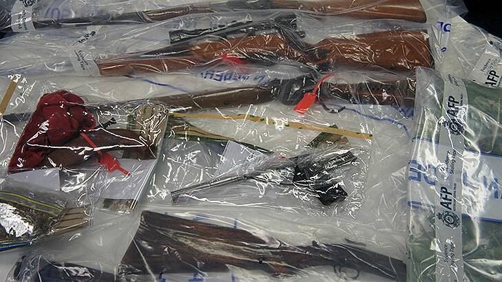 Police seized firearms and ammunition in two raids across Canberra.