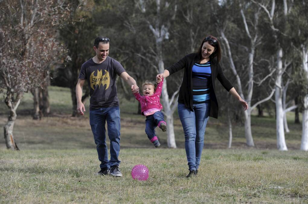 Michael, Rebecca and 14-month-old Hazel Amaro enjoy Black Mountain Park. Photo: Graham Tidy