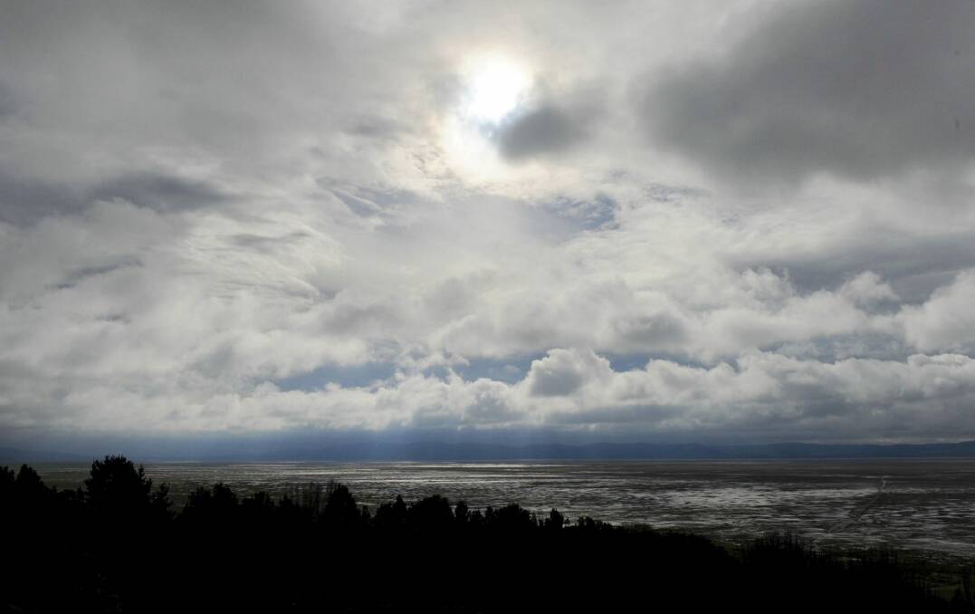 The sun creeps through the clouds on Monday morning after a weekend of rain at Lake George. Photo: Graham Tidy
