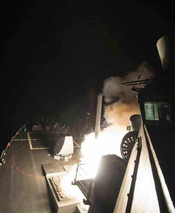 In this image provided by the US Navy, the USS Ross (DDG 71) fires a tomahawk land attack missile on Friday, April 7, from the Mediterranean Sea. . Photo: AP