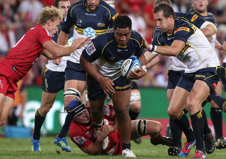 Brumby Ita Vaea charges through a gap against the Reds earlier this year. Photo: Getty Images